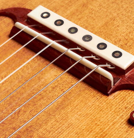 The bridge of a 2023 Wolfgang Jellinghaus "La Romantica 1a" romantic guitar made with spruce and maple.