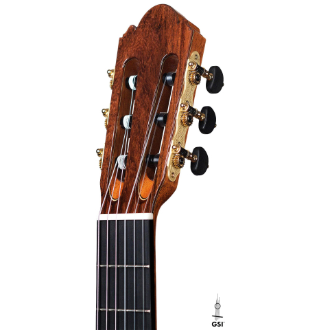 The headstock and black machine heads of a 2020 Wolfgang Jellinghaus "Alemana EF CD/CD" CD/AR classical guitar made with double top cedar and African rosewood back and sides The headstock and black machine heads of a 2020 Wolfgang Jellinghaus "Alemana EF CD/CD" CD/AR classical guitar made with double top cedar and African rosewood back and sides