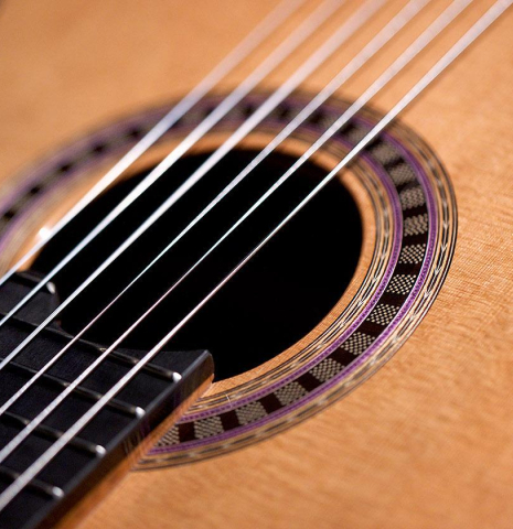 The soundboard and rosette of a 2020 Wolfgang Jellinghaus "Alemana EF CD/CD" CD/AR classical guitar made with double top cedar and African rosewood back and sides The soundboard and rosette of a 2020 Wolfgang Jellinghaus "Alemana EF CD/CD" CD/AR classical guitar made with double top cedar and African rosewood back and sides
