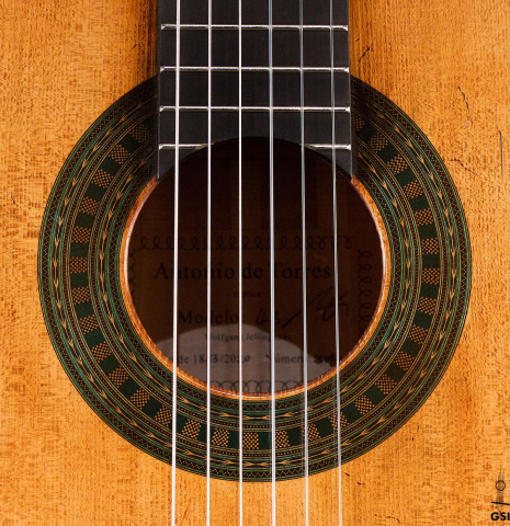 The rosette of a 2023 Wolfgang Jellinghaus “Torres 43” classical guitar made with spruce and maple.