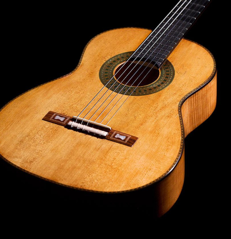 The front of a 2023 Wolfgang Jellinghaus “Torres 43” classical guitar made with spruce and maple.