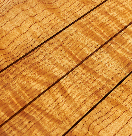 The back center strips and inlays of a Wolfgang Jellinghaus “Torres 43” classical guitar made with spruce and maple.