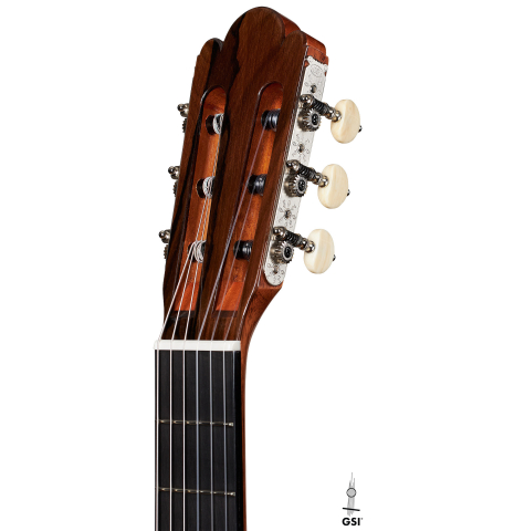 The headstock of a Wolfgang Jellinghaus “Torres 43” classical guitar made with spruce and maple.