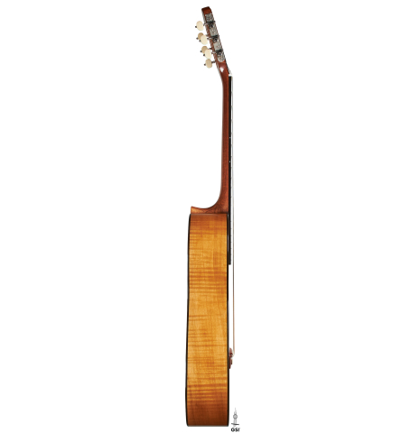 The side of a Wolfgang Jellinghaus “Torres 43” classical guitar made with spruce and maple.