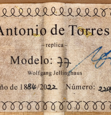 The label of a 2022 Wolfgang Jellinghaus &quot;Torres 77&quot; classical guitar made with spruce and cypress