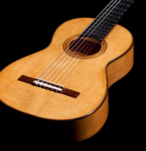 The smaller soundboard of a 2022 Wolfgang Jellinghaus &quot;Torres 77&quot; classical guitar made with spruce and cypress