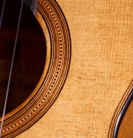 The rosette and soundbaord of a 2022 Wolfgang Jellinghaus &quot;Torres 77&quot; classical guitar made with spruce and cypress