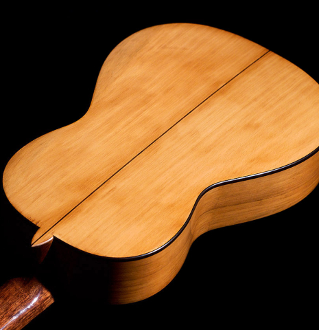 The smaller back of a 2022 Wolfgang Jellinghaus &quot;Torres 77&quot; classical guitar made with spruce and cypress