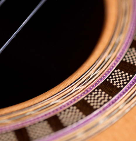 Closeup of the rosette of a Wolfgang Jellinghaus "Alemana" 1a CD/CD" classical guitar made of cedar and African rosewood