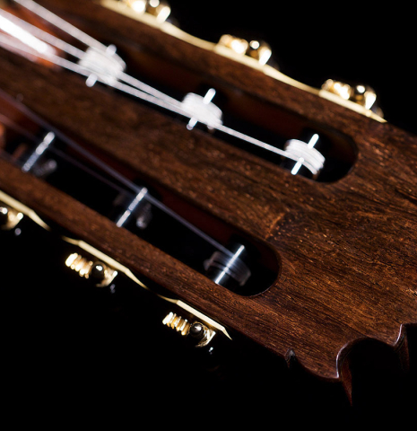 The headstock and tuning machines of a Wolfgang Jellinghaus "Alemana" 1a CD/CD" classical guitar made of cedar and African rosewood