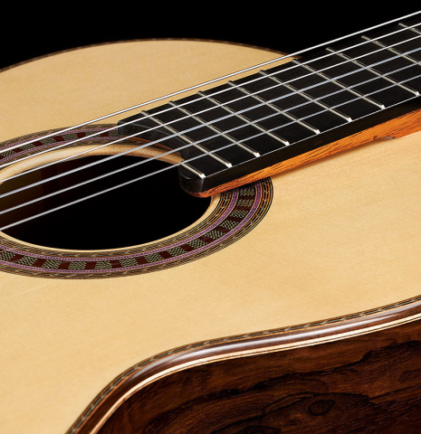 The top and elevated fingerboard of a 2024 Wolfgang Jellinghaus "Signature SP/SP" double top classical guitar made of spruce and ziricote