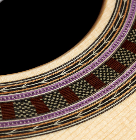 Closeup detail of the rosette of a 2024 Wolfgang Jellinghaus "Signature SP/SP" double top classical guitar made of spruce and ziricote