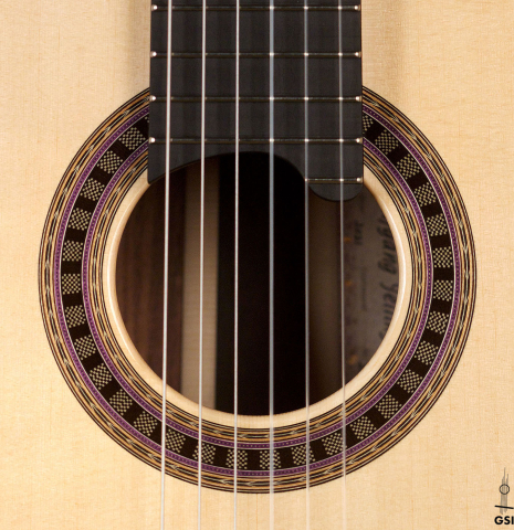 The rosette of a 2023 Wolfgang Jellinghaus &quot;Signature SP/SP 640&quot; classical guitar made of spruce and granadillo.