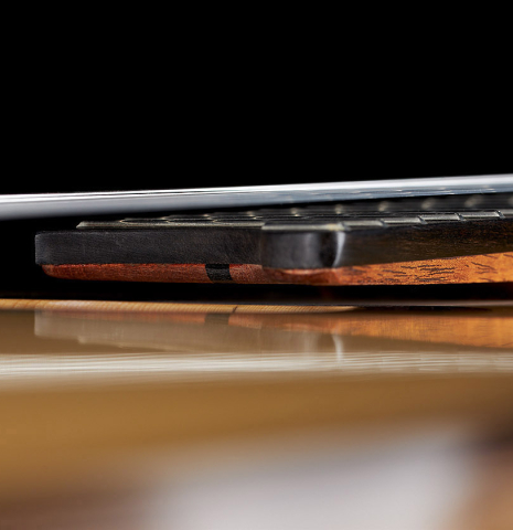 The elevated and floating fingerboard of a 2024 Wolfgang Jellinghaus "Signature SP/SP 640" classical guitar made of spruce and granadillo