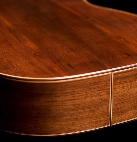 The back and sides of a 2022 Wolfgang Jellinghaus &quot;Alemana EF SP/CD&quot; double top classical guitar made of spruce and African rosewood