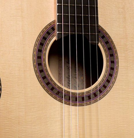 The rosette and soundboard of a Wolfgang Jellinghaus "Alemana EF SP/CD" double top classical guitar made of spruce and African rosewood