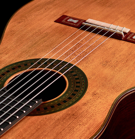 The soundboard of a Wolfgang Jellinghaus “Torres 43” classical guitar made with spruce and Indian rosewood