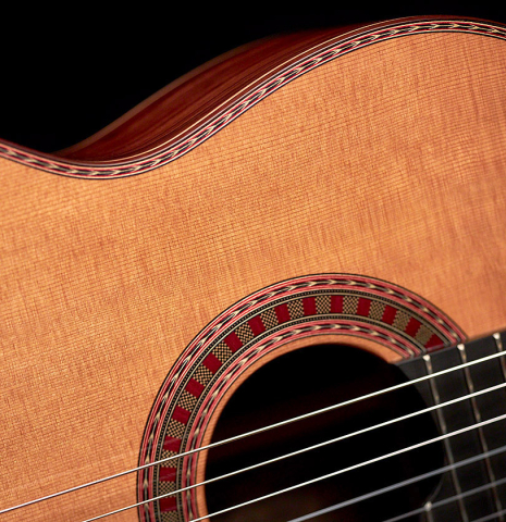 This is the soundboard, binding and rosette of a Wolfgang Jellinghaus "Espanola 1a" guitar made with cedar soundboard and African rosewood back and sides