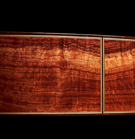 The side of a 2022 Wolfgang Jellinghaus &quot;Signature SP/SP 630&quot; double top guitar made of spruce and granadillo