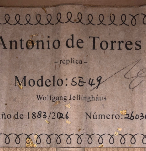 The label of a Wolfgang Jellinghaus “Torres 49 - ex Tarrega” classical guitar made of spruce and maple