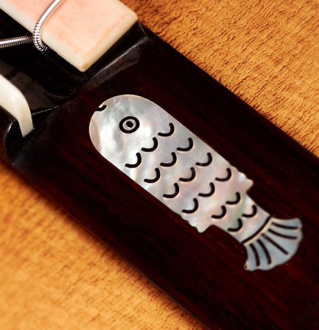 The fish-shaped ornament of a Wolfgang Jellinghaus “Torres 49 - ex Tarrega” classical guitar made of spruce and maple