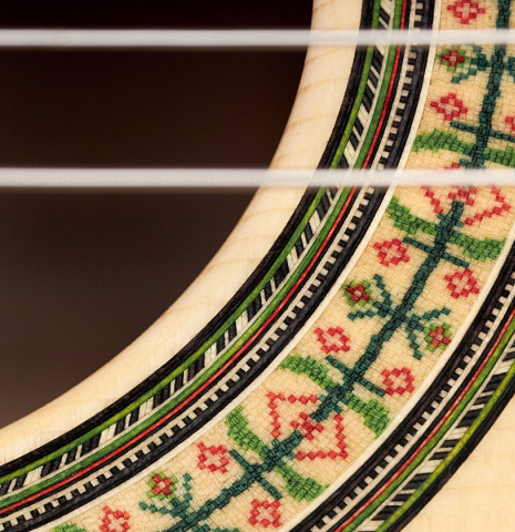 The rosette detail of a Wolfgang Jellinghaus "1912 Ex-Segovia" classical guitar made of spruce and Pau Ferro.