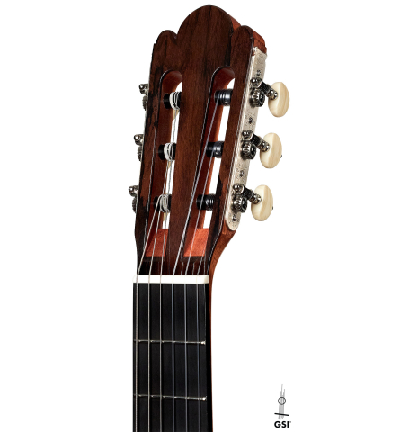The headstock of a Wolfgang Jellinghaus “Torres 43 - clear” classical guitar made with spruce and maple.