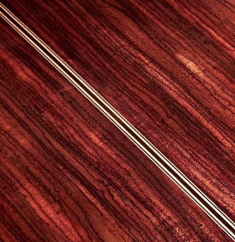 The back of a 2023 Wolfgang Jellinghaus "Conservatory EF 1a" classical guitar made with spruce and Indian rosewood.