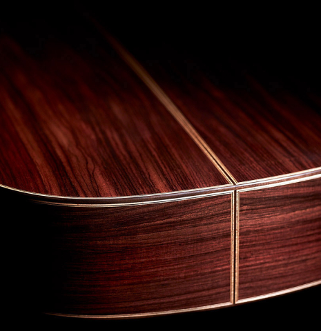 The lower bout and back of a 2023 Wolfgang Jellinghaus "Conservatory EF 1a" classical guitar made with spruce and Indian rosewood.