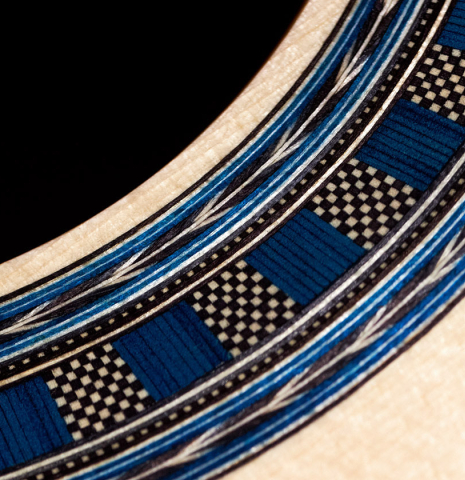 The rosette of a 2023 Wolfgang Jellinghaus "Conservatory EF 1a" classical guitar made with spruce and Indian rosewood.