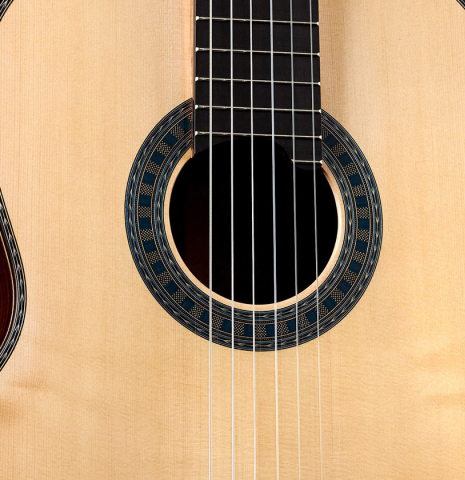 The soundboard of a 2023 Wolfgang Jellinghaus "Conservatory EF 1a" classical guitar made with spruce and Indian rosewood.