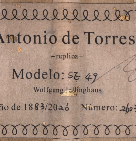 The label of a Wolfgang Jellinghaus “Torres 49 - clear - ex Tarrega” classical guitar made of spruce and maple