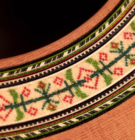 Closeup of the rosette of a Wolfgang Jellinghaus "1912 Ex-Segovia 640" classical guitar made of cedar and Pau Ferro.