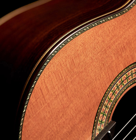 The soundboard and side of a Wolfgang Jellinghaus "1912 Ex-Segovia 640" classical guitar made of cedar and Pau Ferro.