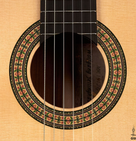 The rosette of a 2023 Wolfgang Jellinghaus "1912 Ex-Segovia 640" classical guitar made of spruce and granadillo.