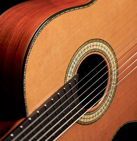 Closeup of the rosette of a Wolfgang Jellinghaus "1912 Ex-Segovia" classical guitar made of cedar and granadillo.
