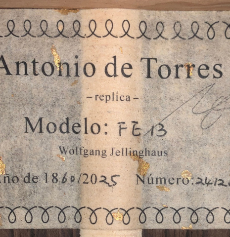 The label of a Wolfgang Jellinghaus “Torres FE 13 - clear” classical guitar made with spruce and Indian rosewood
