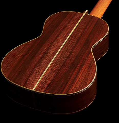 The back and sides of a Wolfgang Jellinghaus “Torres FE 13 - clear” classical guitar made with spruce and Indian rosewood