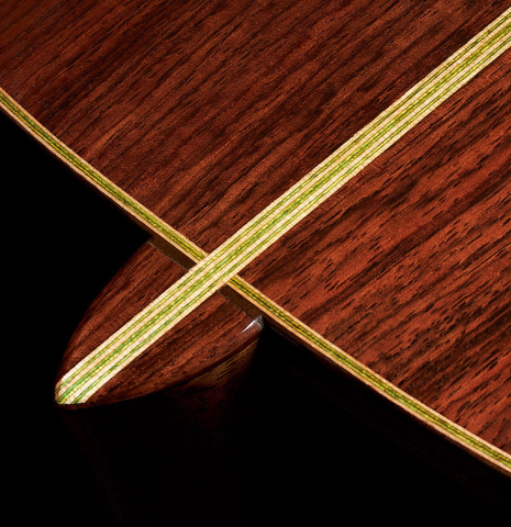 The heel and back center seam of a Wolfgang Jellinghaus “Torres FE 13 - clear” classical guitar made with spruce and Indian rosewood