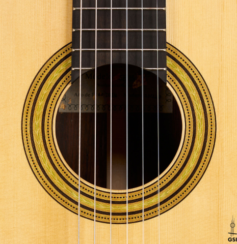 The rosette of a Wolfgang Jellinghaus “Torres FE 13 - clear” classical guitar made with spruce and Indian rosewood
