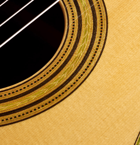 Detail of the rosette of a Wolfgang Jellinghaus “Torres FE 13 - clear” classical guitar made with spruce and Indian rosewood