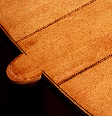 The heel, back purfling and binding of a 2023 Wolfgang Jellinghaus “Torres 114 - ex Tarrega” classical guitar made of spruce and cypress