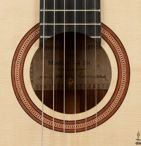 This is the rosette of a Wolfgang Jellinghaus "Torres 77 - clear" classical guitar made of spruce and granadillo
