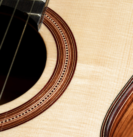 This is the top and rosette of a Wolfgang Jellinghaus "Torres 77 - clear" classical guitar made of spruce and granadillo