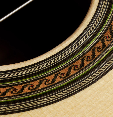 Close-up detail of the rosette of a Wolfgang Jellinghaus "1912 Ex-Segovia 630" classical guitar made of spruce and ziricote