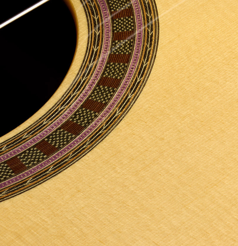 The top and rosette detail of a Wolfgang Jellinghaus "Signature SP/CD 640" classical guitar made of spruce/cedar and ziricote