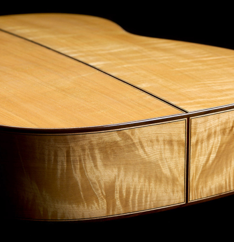 The back and sides at the foot of a Wolfgang Jellinghaus "1912 Ex-Segovia 640" classical guitar made of spruce and maple