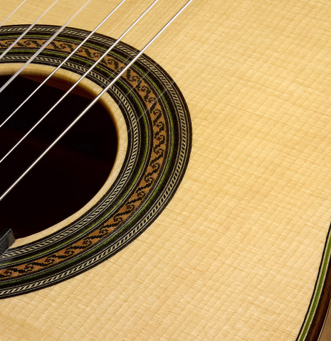 The soundboard and rosette of a Wolfgang Jellinghaus "1912 Ex-Segovia 640" classical guitar made of spruce and maple