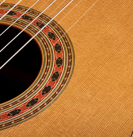 The soundboard and rosette of a 2026 Wolfgang Jellinghaus "Friederich" classical guitar made of cedar and Indian rosewood