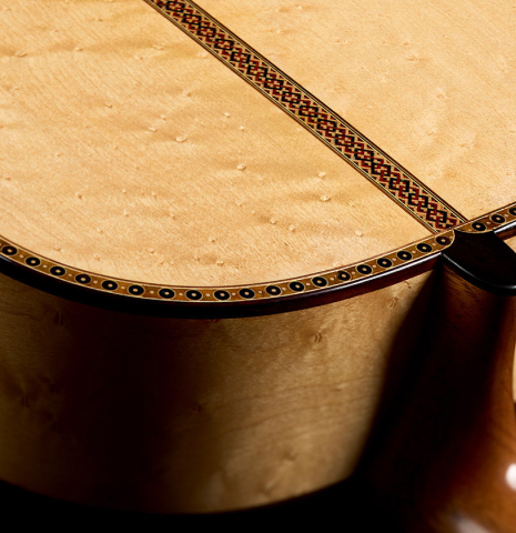 The heel, back binding and purfling of a 2026 Federico Jiang "Arias" classical guitar made of spruce and maple